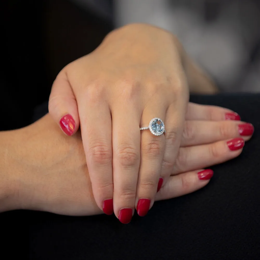 18ct White Gold 2.49ct Oval Cut Aquamarine With 0.40ct Diamond Halo and Diamond Set Shoulders Ring