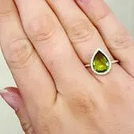 Pear Shaped Peridot with Diamond Halo on Diamond Accented Band