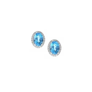 Silver blue topaz stud earrings with halo surround